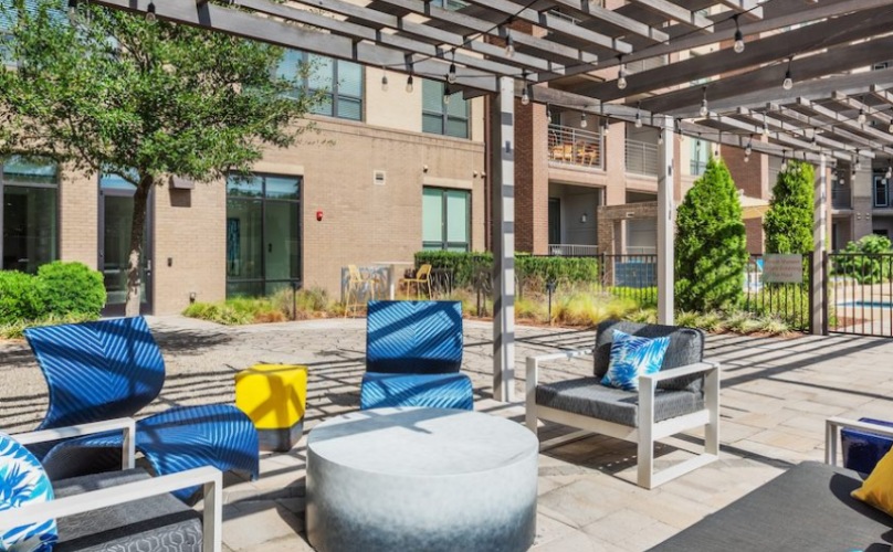 Outdoor seating area on pool deck 